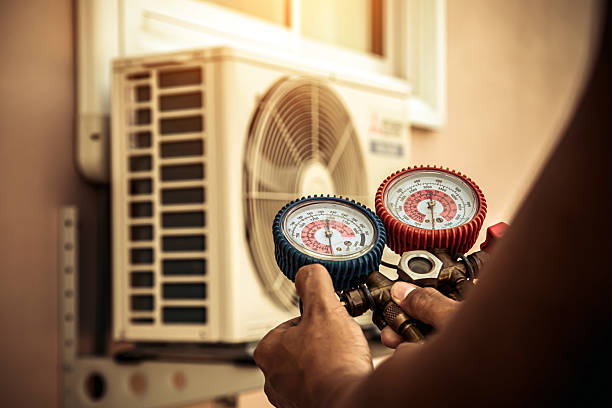Professional Air Conditioning Service technician working in Remsenburg, NY